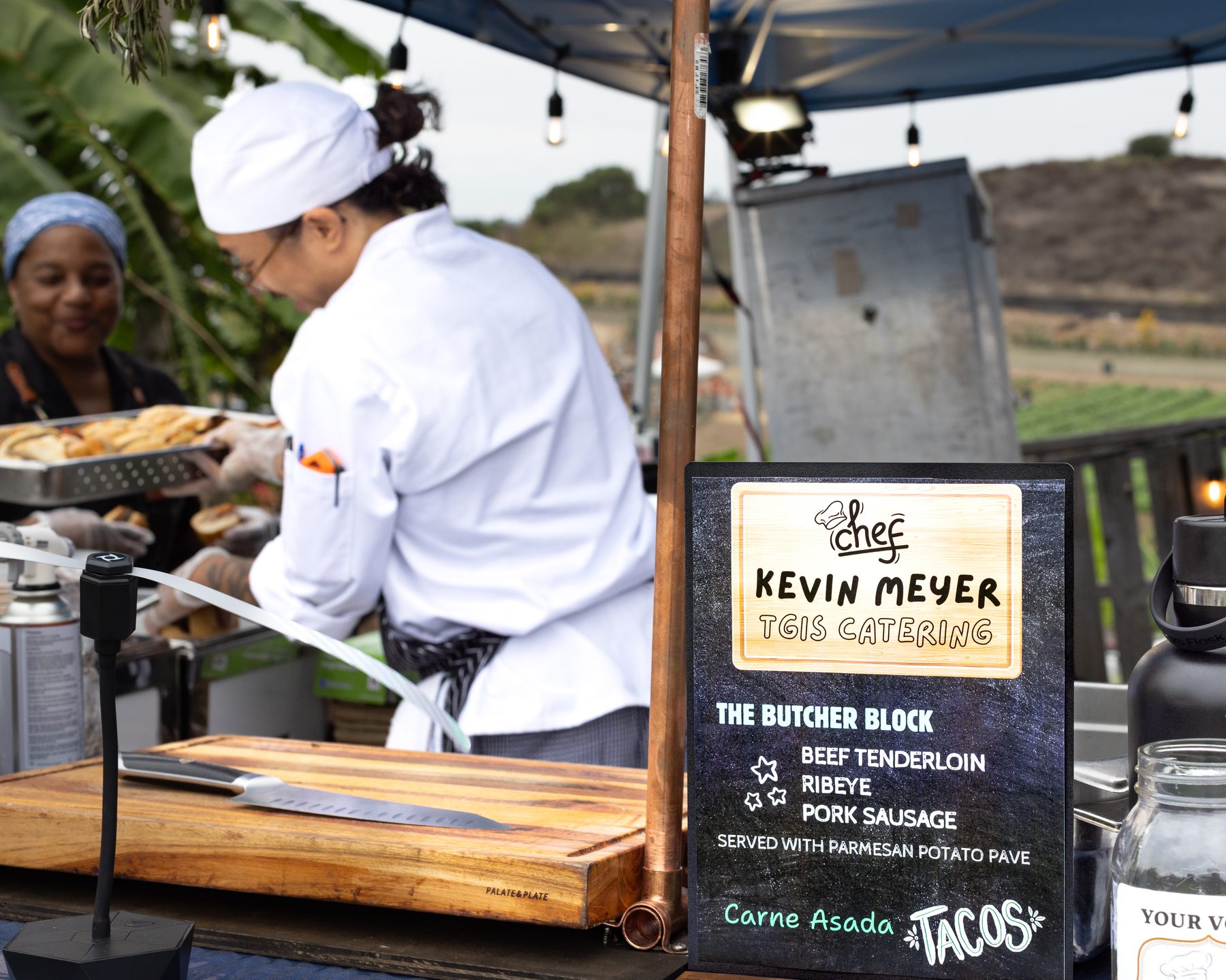 Chef preparing food at Harvest Moon event