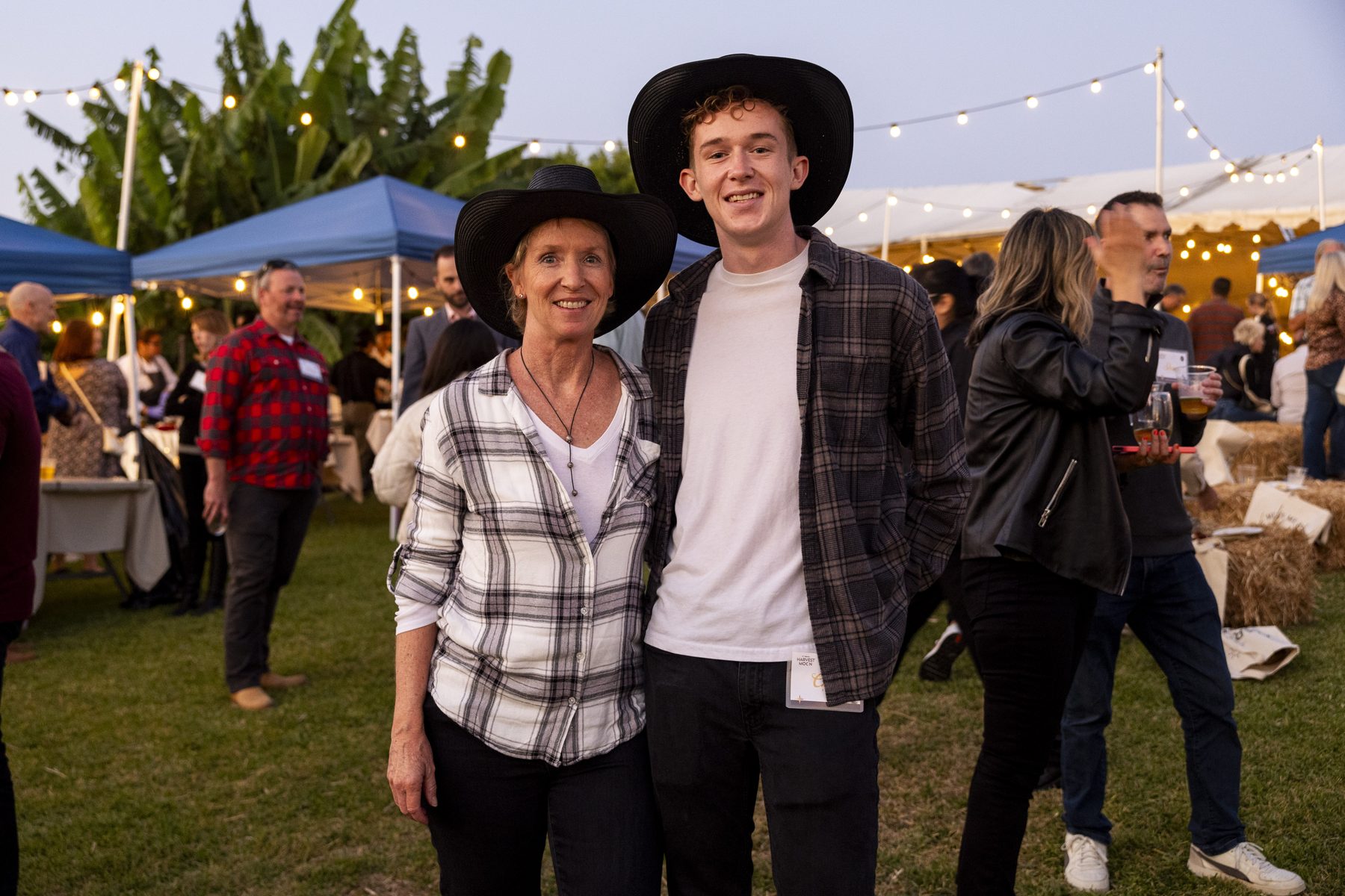Mother and son in cowboy hats at Harvest Moon