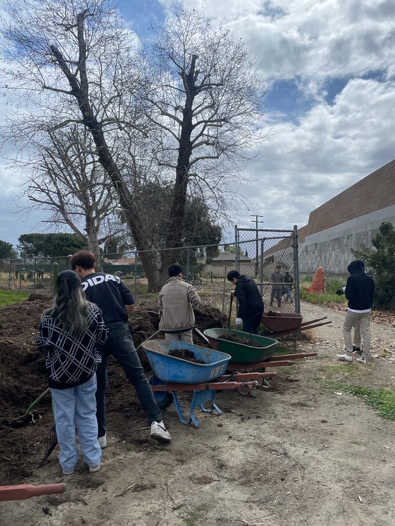 Students learning at The Giving Farm
