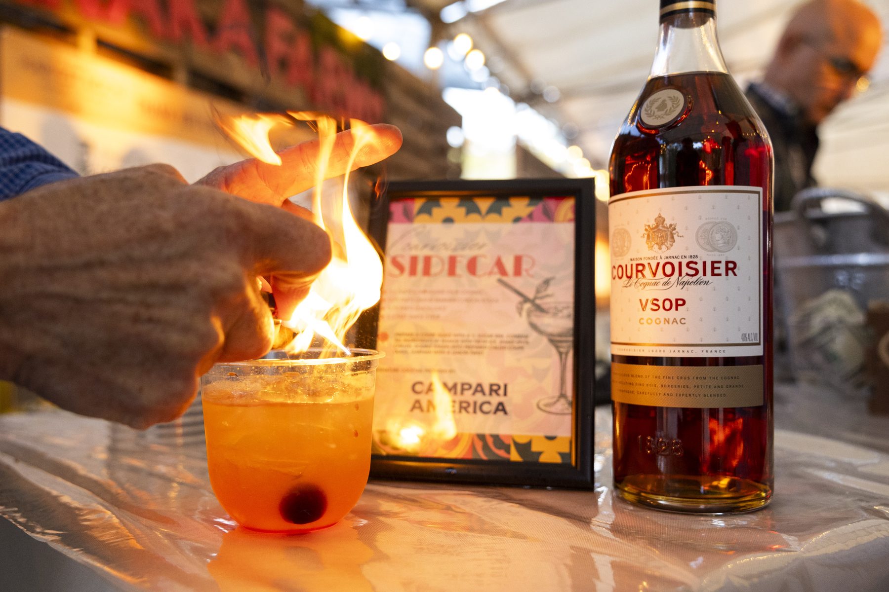 A flaming signature cocktail prepared at the Harvest Moon bar
