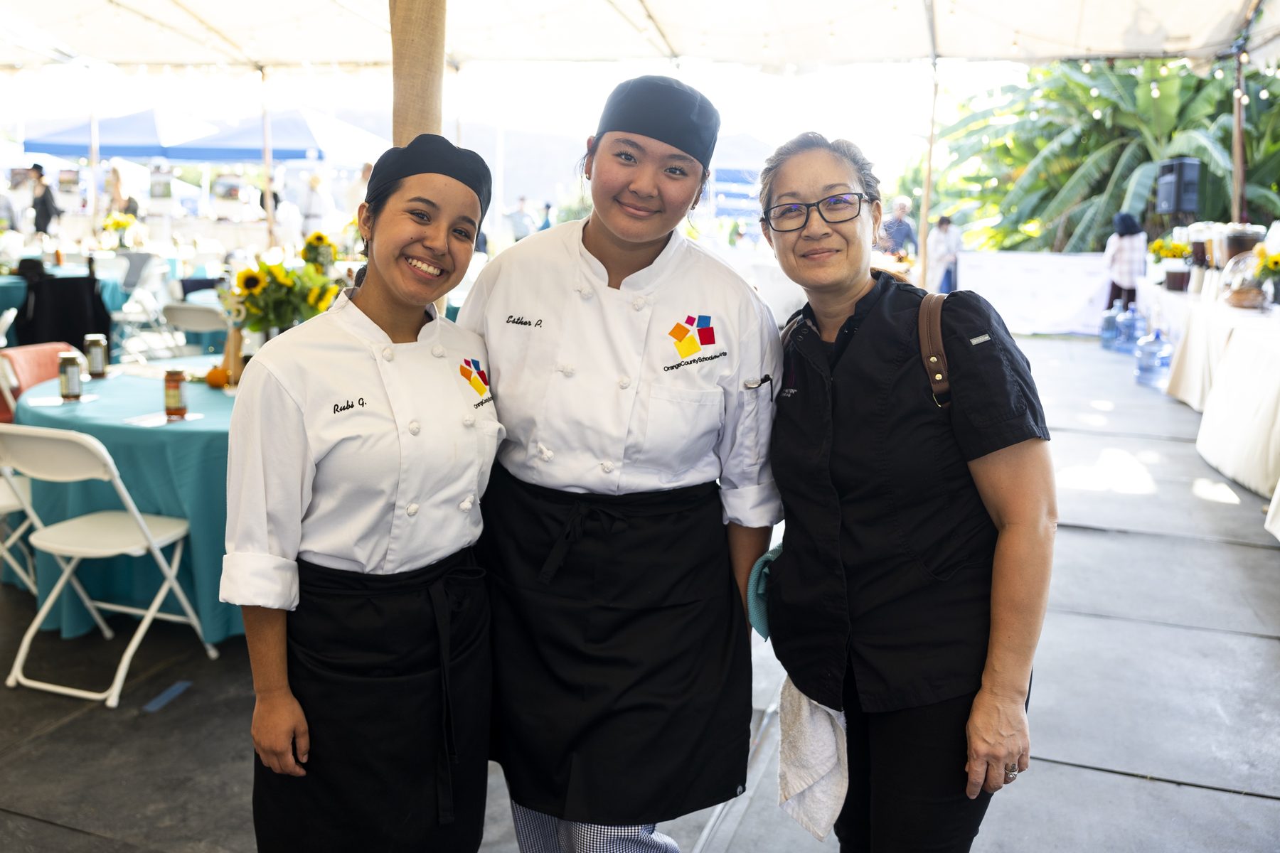Culinary students smiling together at the Harvest Moon dinner