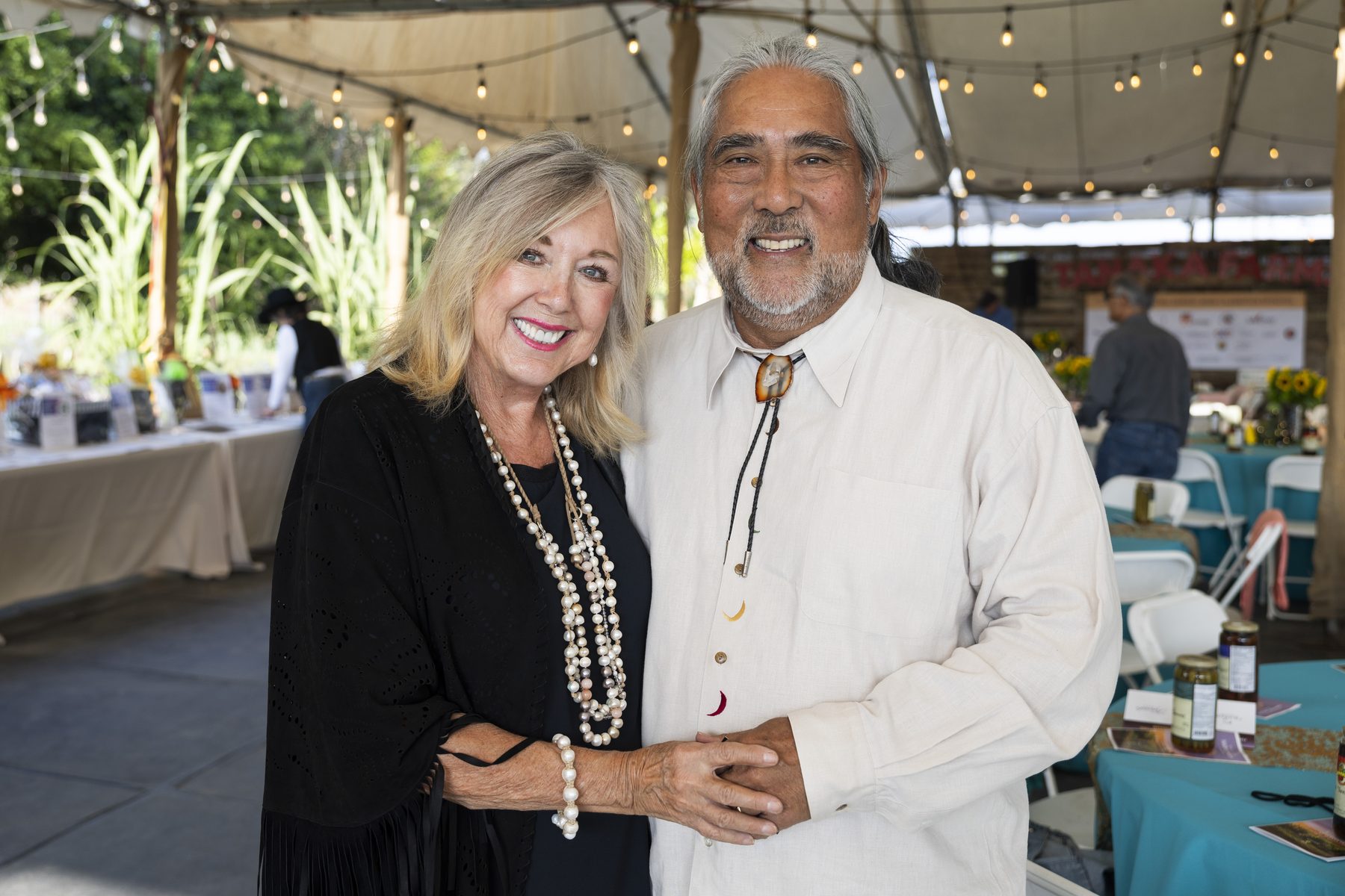 A couple posing together at the Harvest Moon dinner