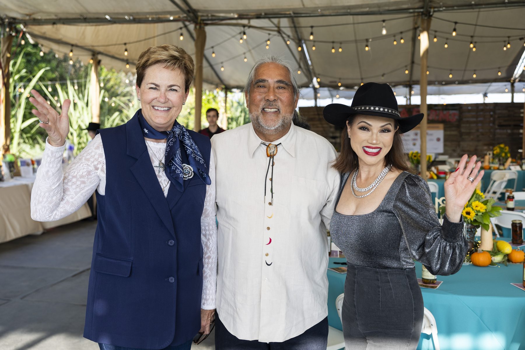 Three guests greeting the camera at Harvest Moon
