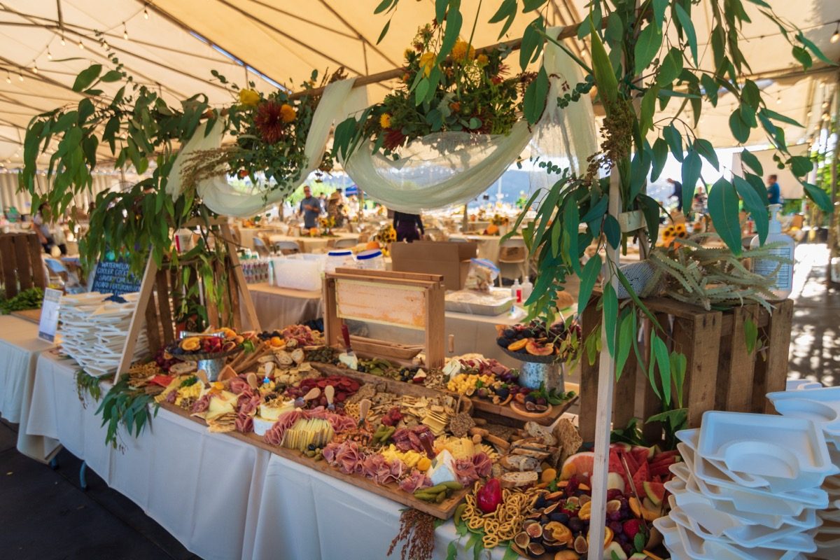 Abundant charcuterie and harvest spread under the tent at Harvest Moon