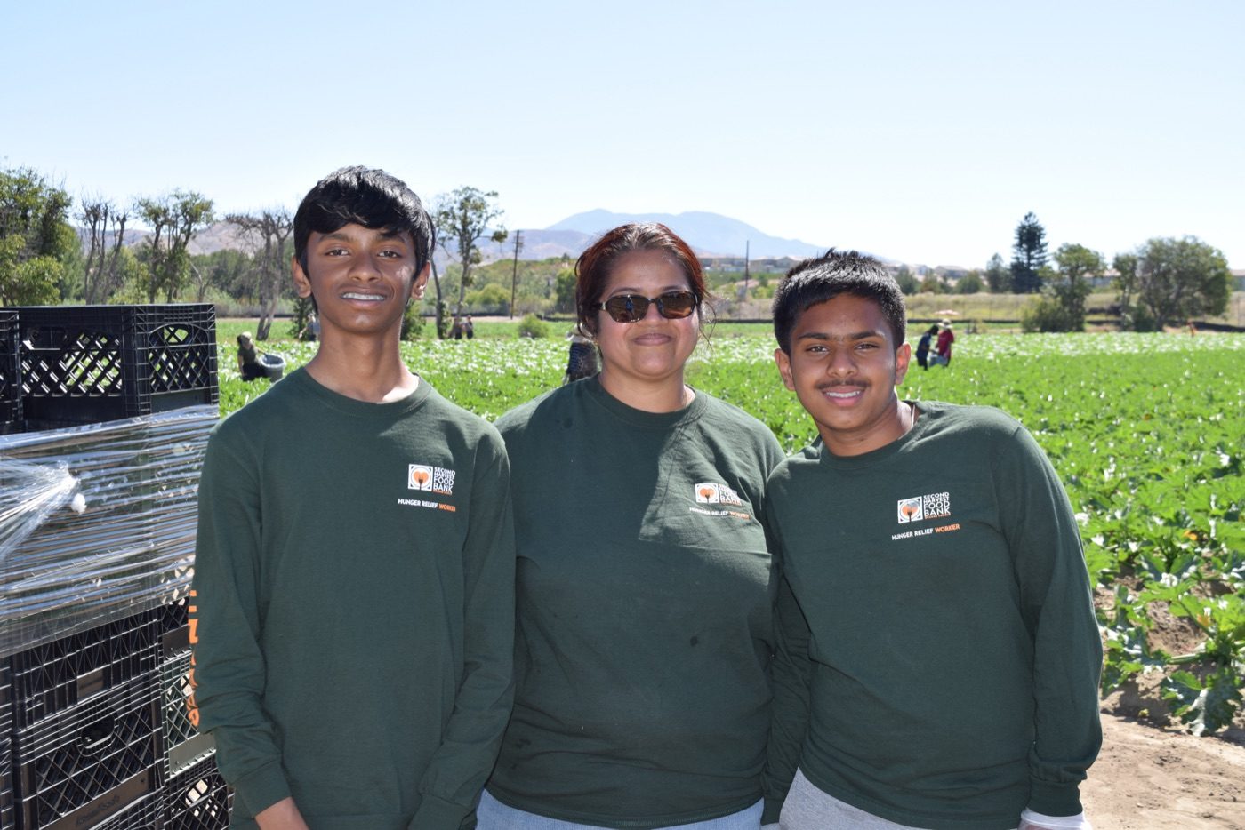 Volunteers working together at a partner farm
